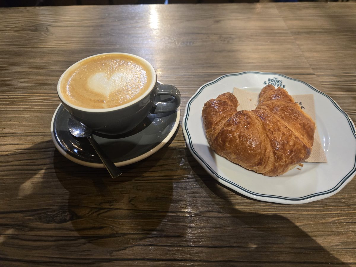 A cappuccino and croissant at a jazz caf&eacute; in Bordeaux
