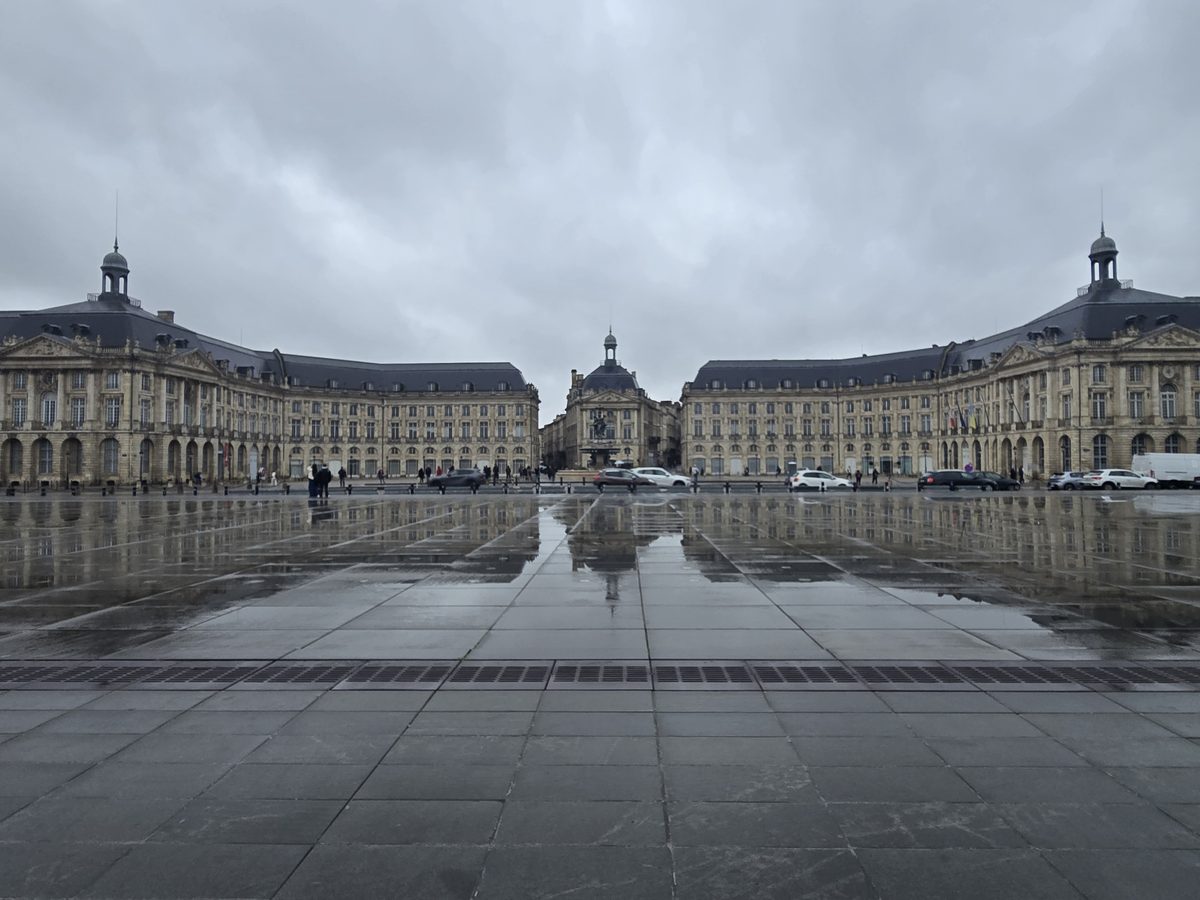 Place de la Bourse reflected in wet stone