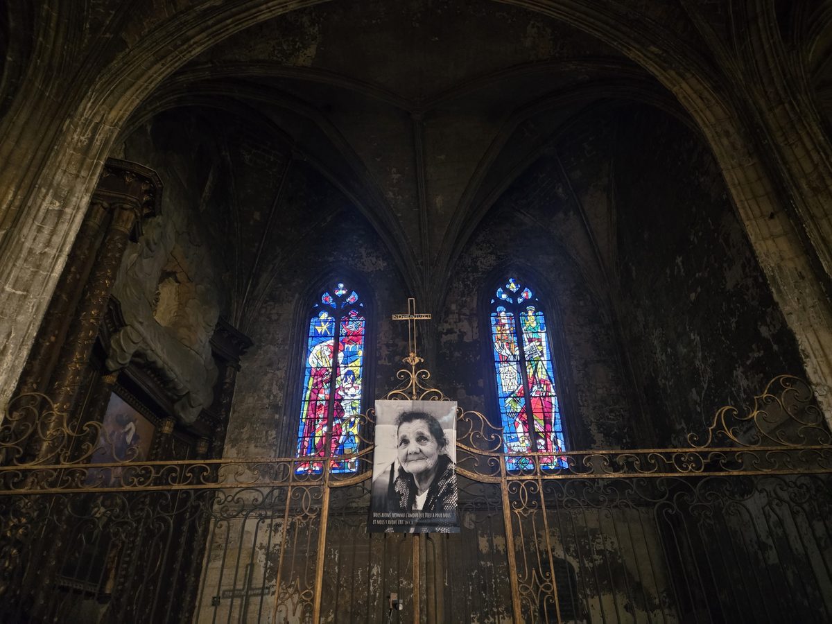 Inside Saint-Michel — ribbed vaults and stained glass
