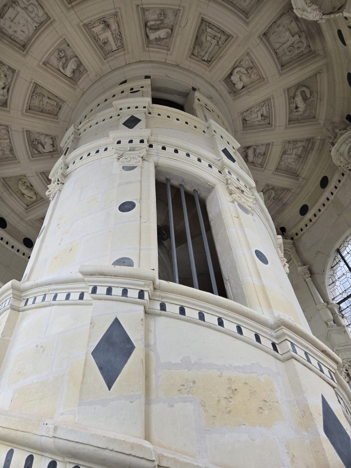 An elaborate painted ceiling with geometric Renaissance designs