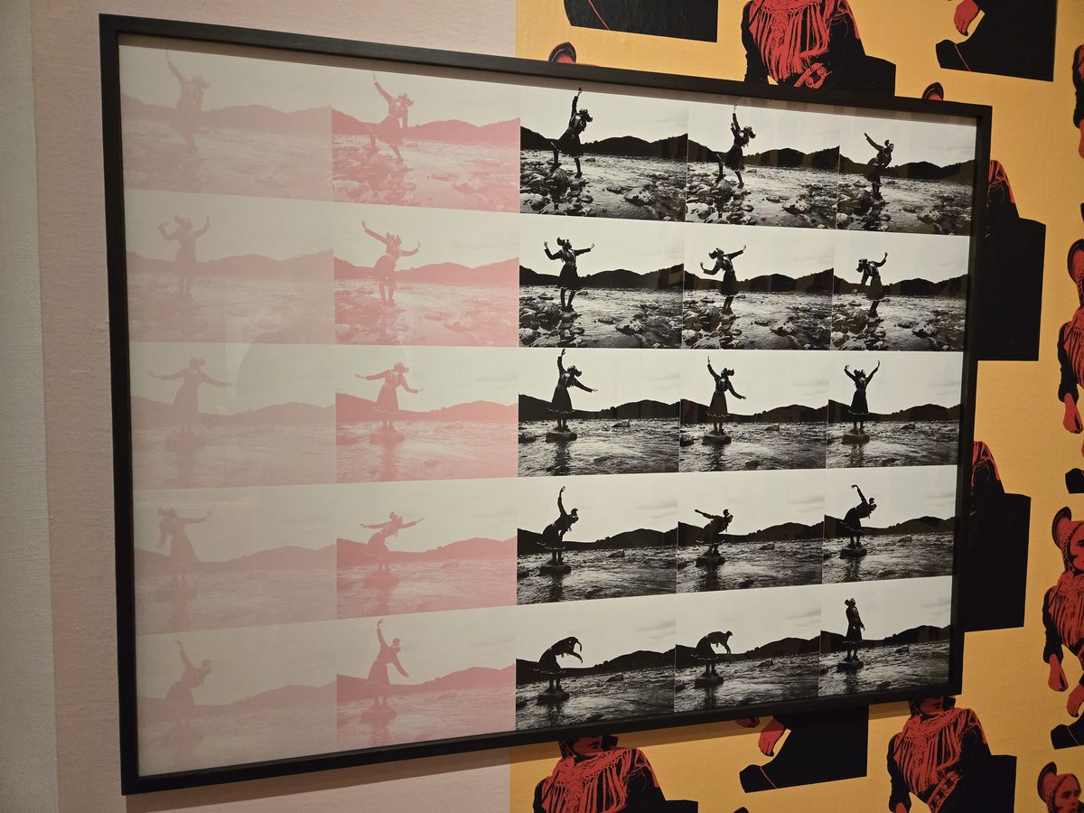 Mixed media exhibit with silhouettes and pink shadow projections themed around a traditional Swedish hat