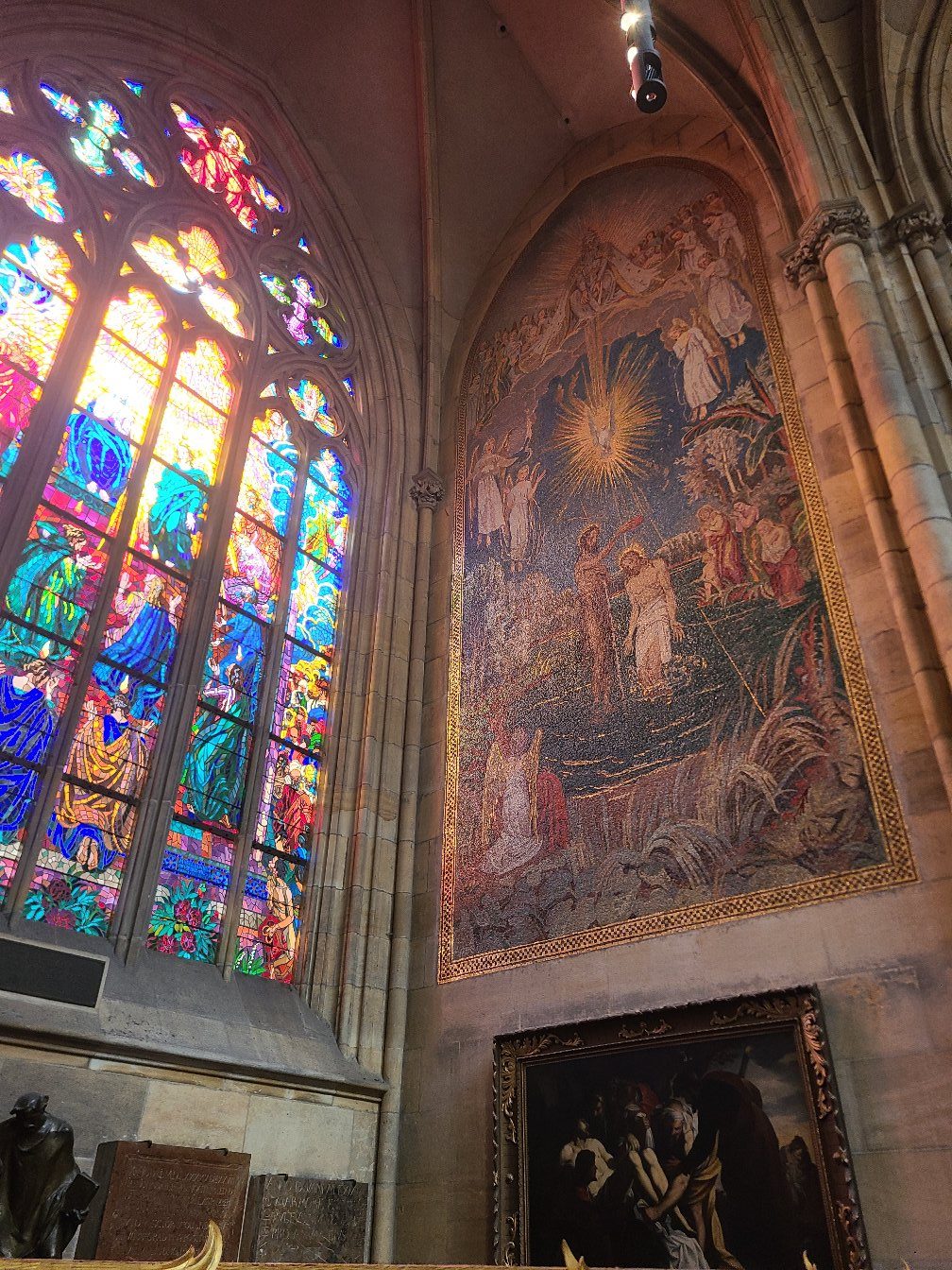Stained glass and ceiling fresco inside St. Vitus Cathedral
