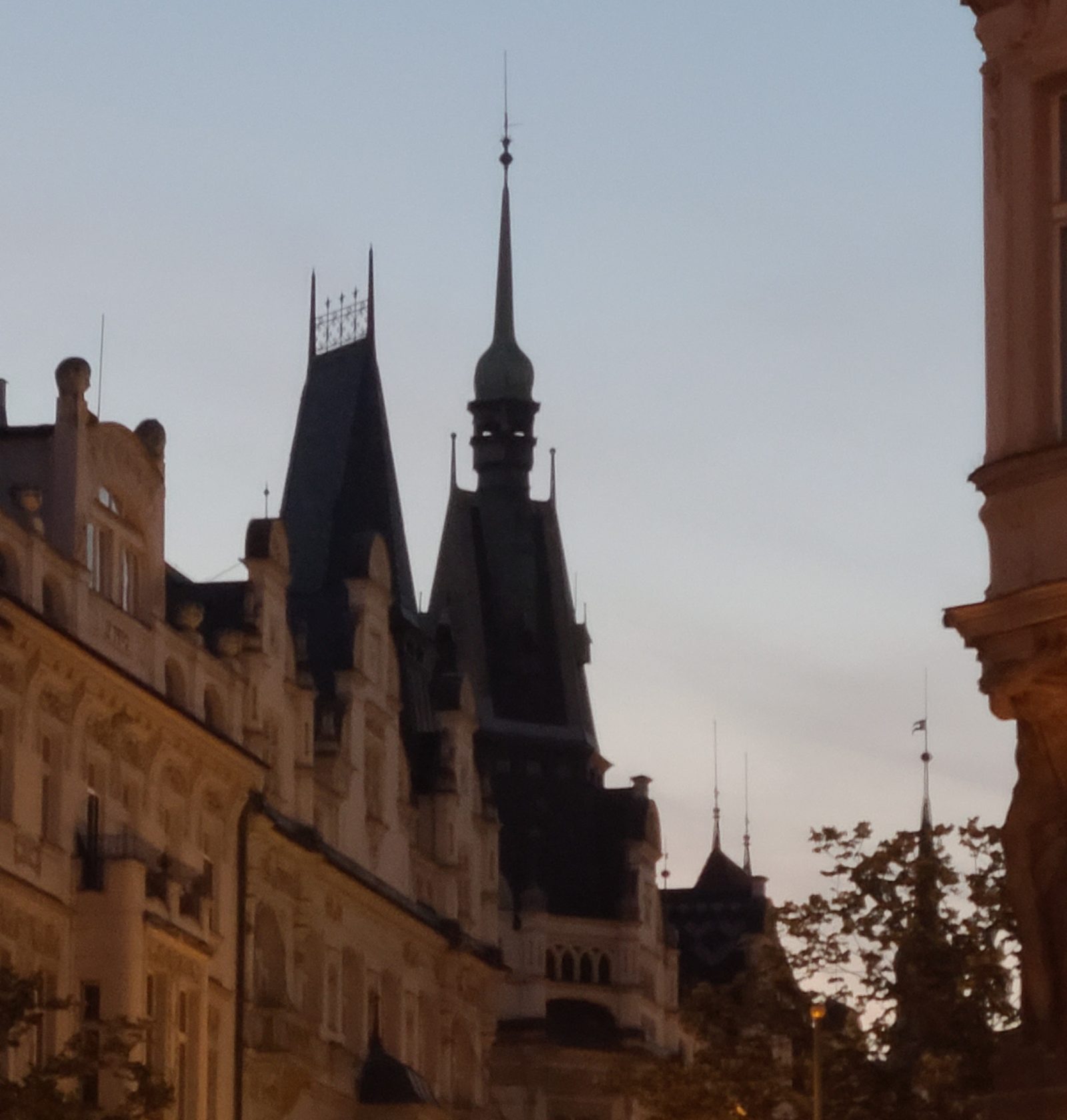 Gothic spires silhouetted against the dusk sky